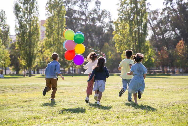 Children playing with balloons